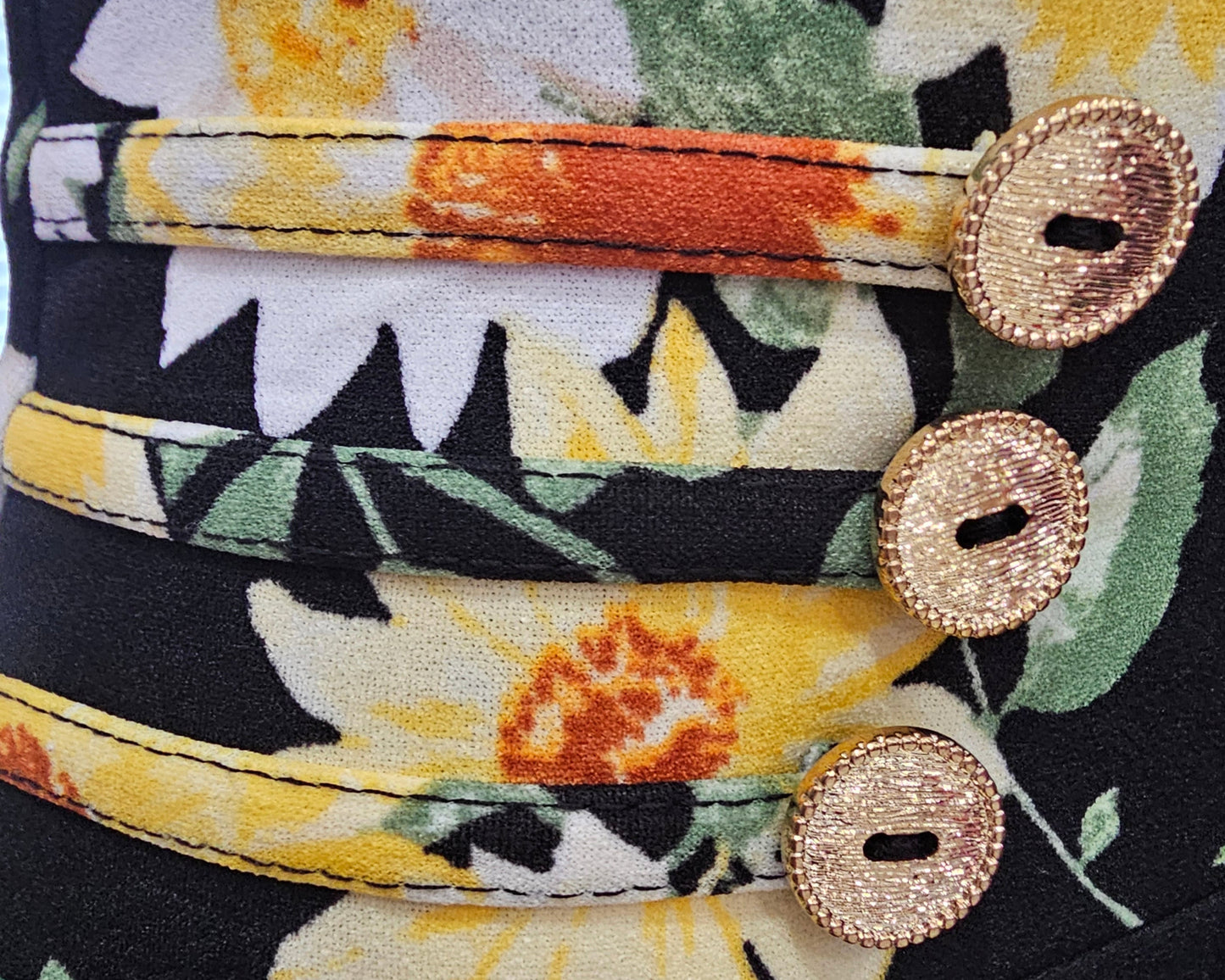 falda botones con lasito negro/amarillo  floriado