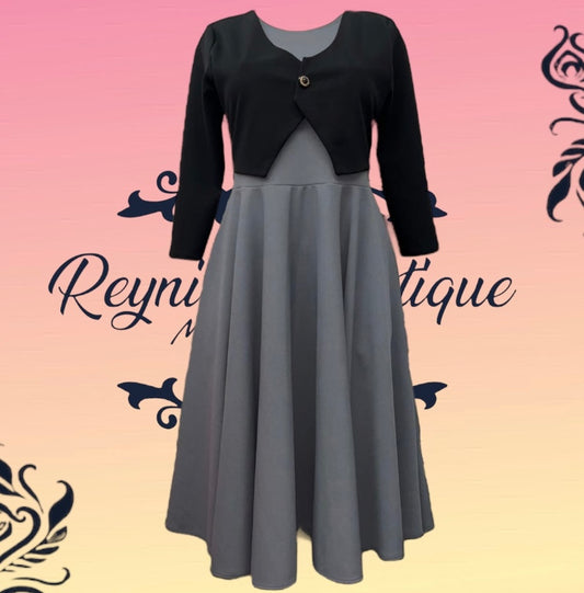 vestido gris con chaleco negro